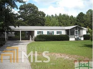 2213 Little McCall Road, Unit 22 Guyton, GA 31312 - Photo 1 of 1 a view of a house with a backyard