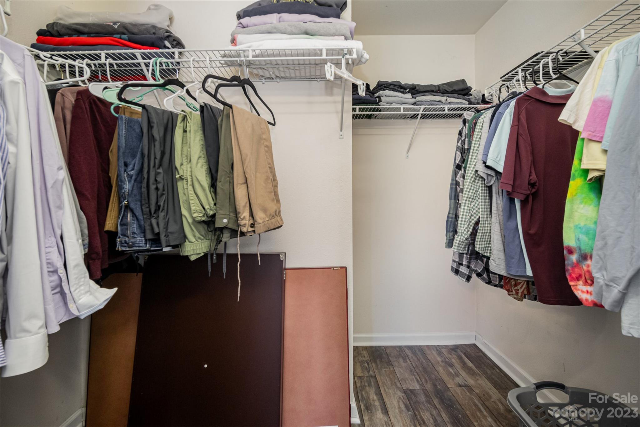 4006 Town Center Road Harrisburg, NC 28075 - Photo 12 of 19 a view of walk in closet with clothes and shoes
