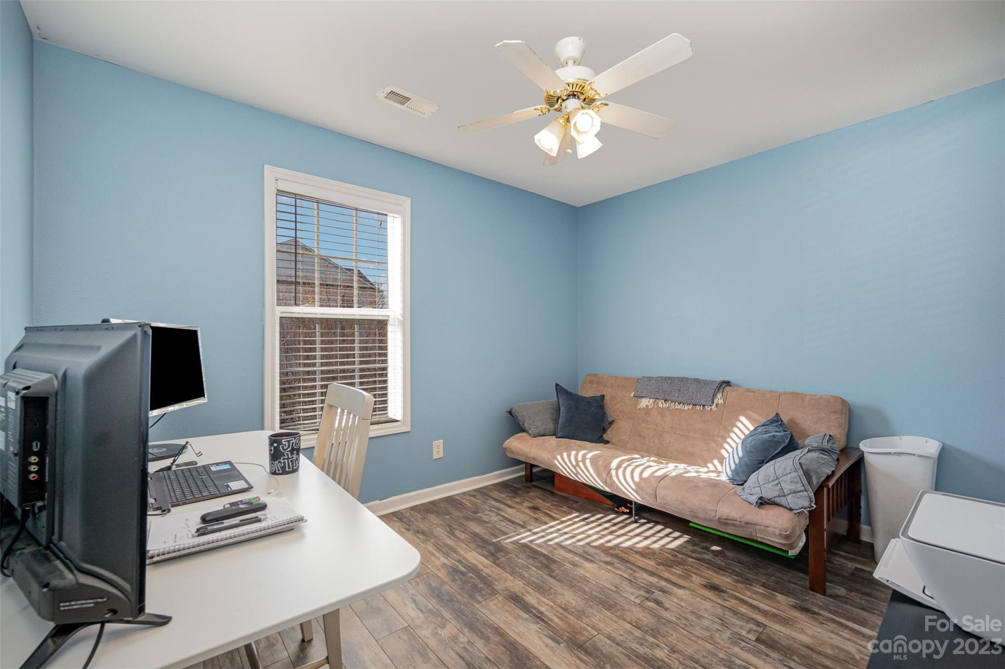 4006 Town Center Road Harrisburg, NC 28075 - Photo 13 of 19 a living room with furniture and a flat screen tv