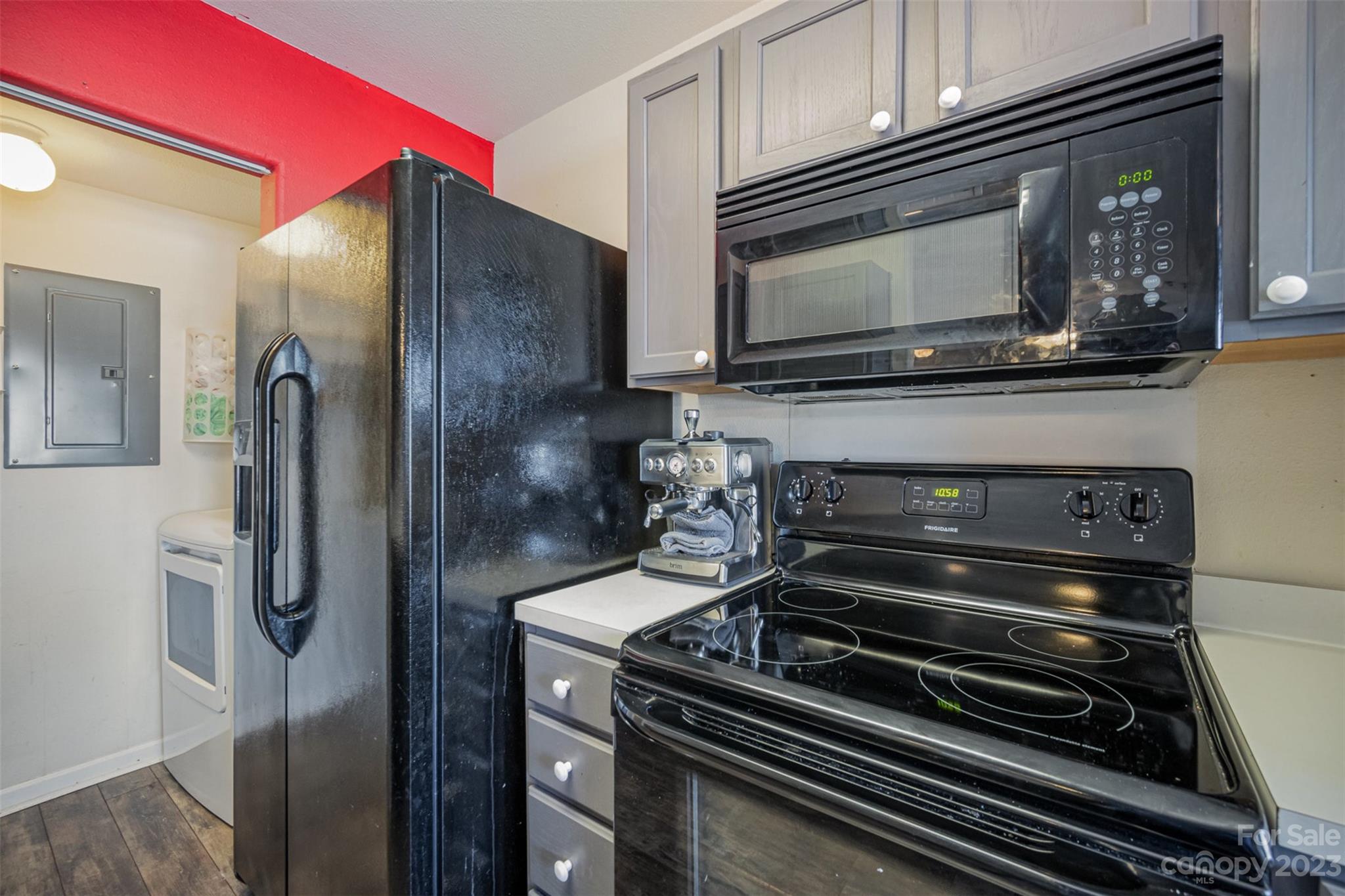 4006 Town Center Road Harrisburg, NC 28075 - Photo 7 of 19 a kitchen with a stove and a microwave