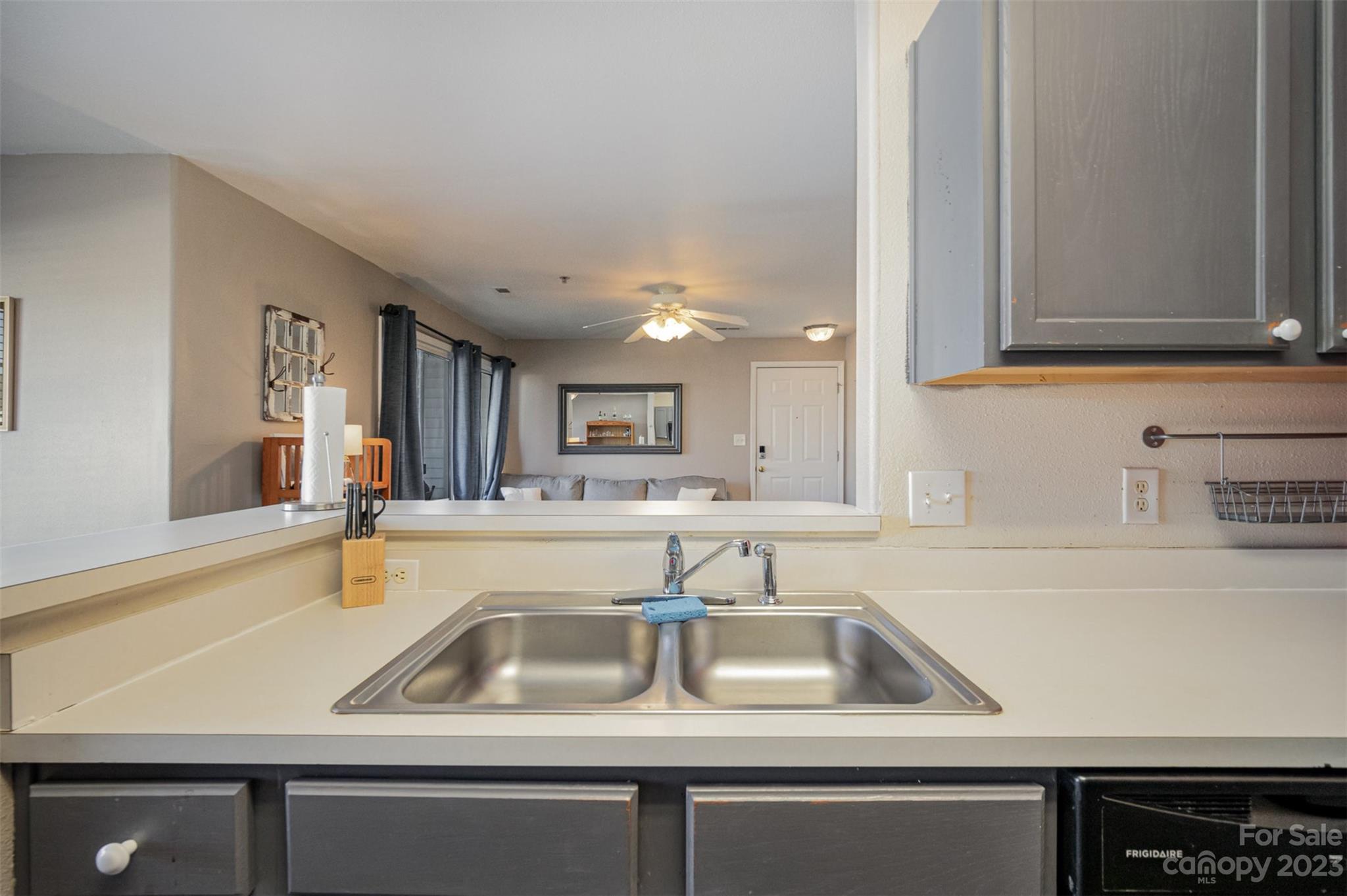 4006 Town Center Road Harrisburg, NC 28075 - Photo 8 of 19 a kitchen with sink and washing machine
