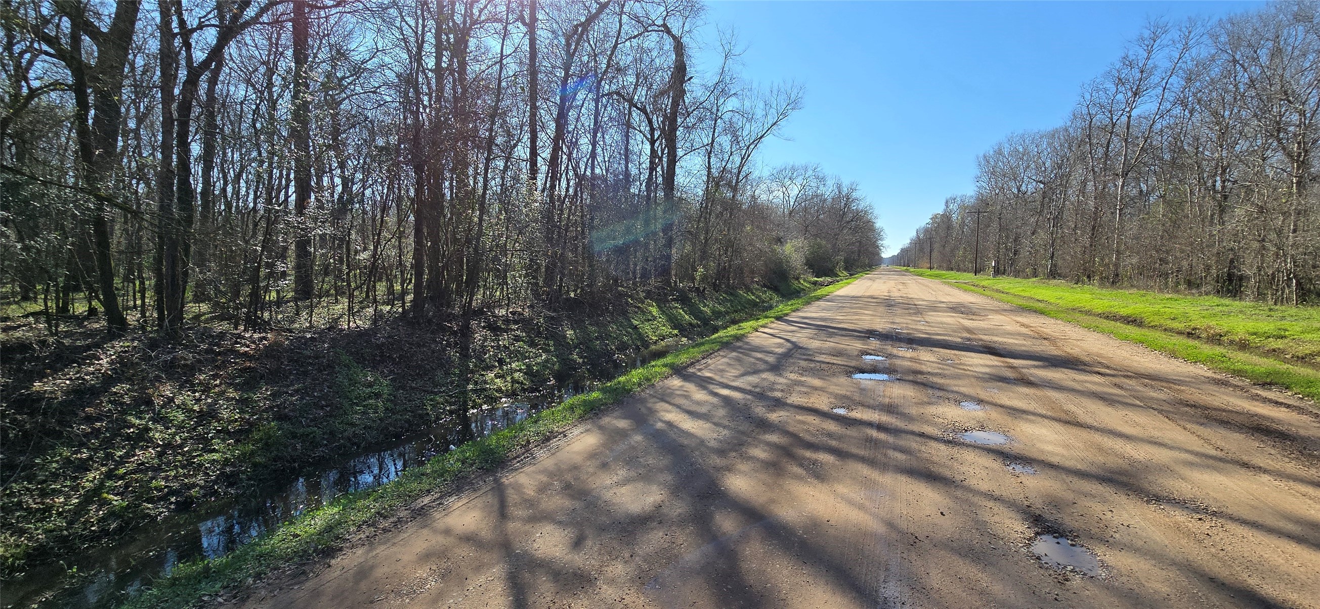 2500 County Road 2500 Liberty, TX 77575 - Photo 3 of 8 a wooden bench with view of trees