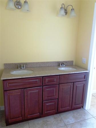 212 Mazarin Street Springfield, MA 01151 - Photo 16 of 22 a bathroom with a sink and vanity