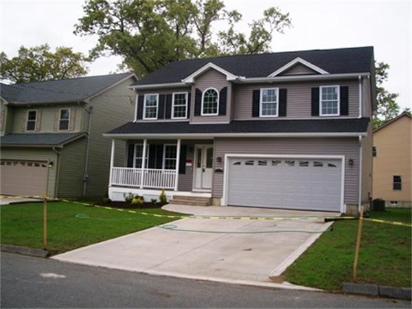 212 Mazarin Street Springfield, MA 01151 - Photo 22 of 22 a front view of a house with a yard and garage