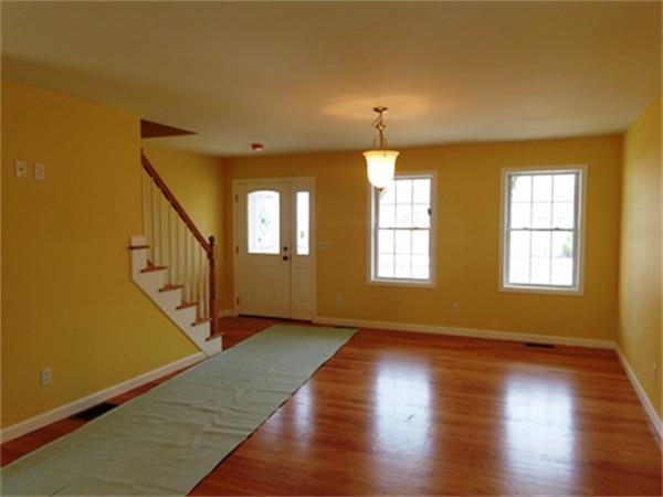 212 Mazarin Street Springfield, MA 01151 - Photo 5 of 22 a view of an empty room with wooden floor and a window