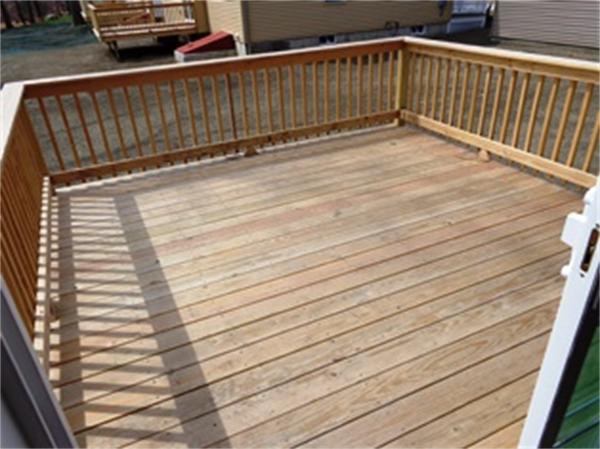 212 Mazarin Street Springfield, MA 01151 - Photo 8 of 22 a view of deck with wooden floor and fence