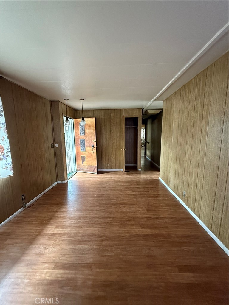 12147 Lakeland Road, Unit 32 Santa Fe Springs, CA 90670 - Photo 2 of 2 a view of an empty room with wooden floor and a window