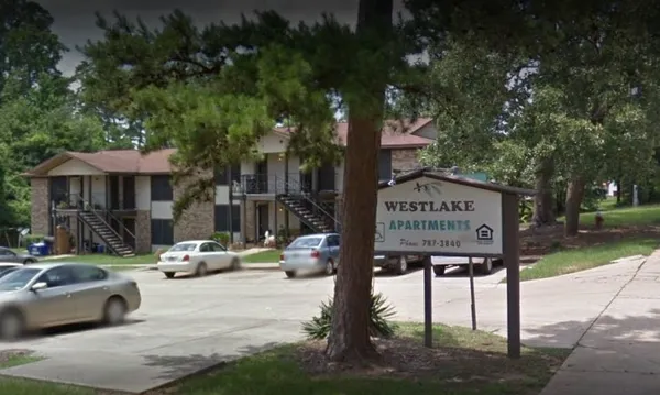 a view of street with parked cars