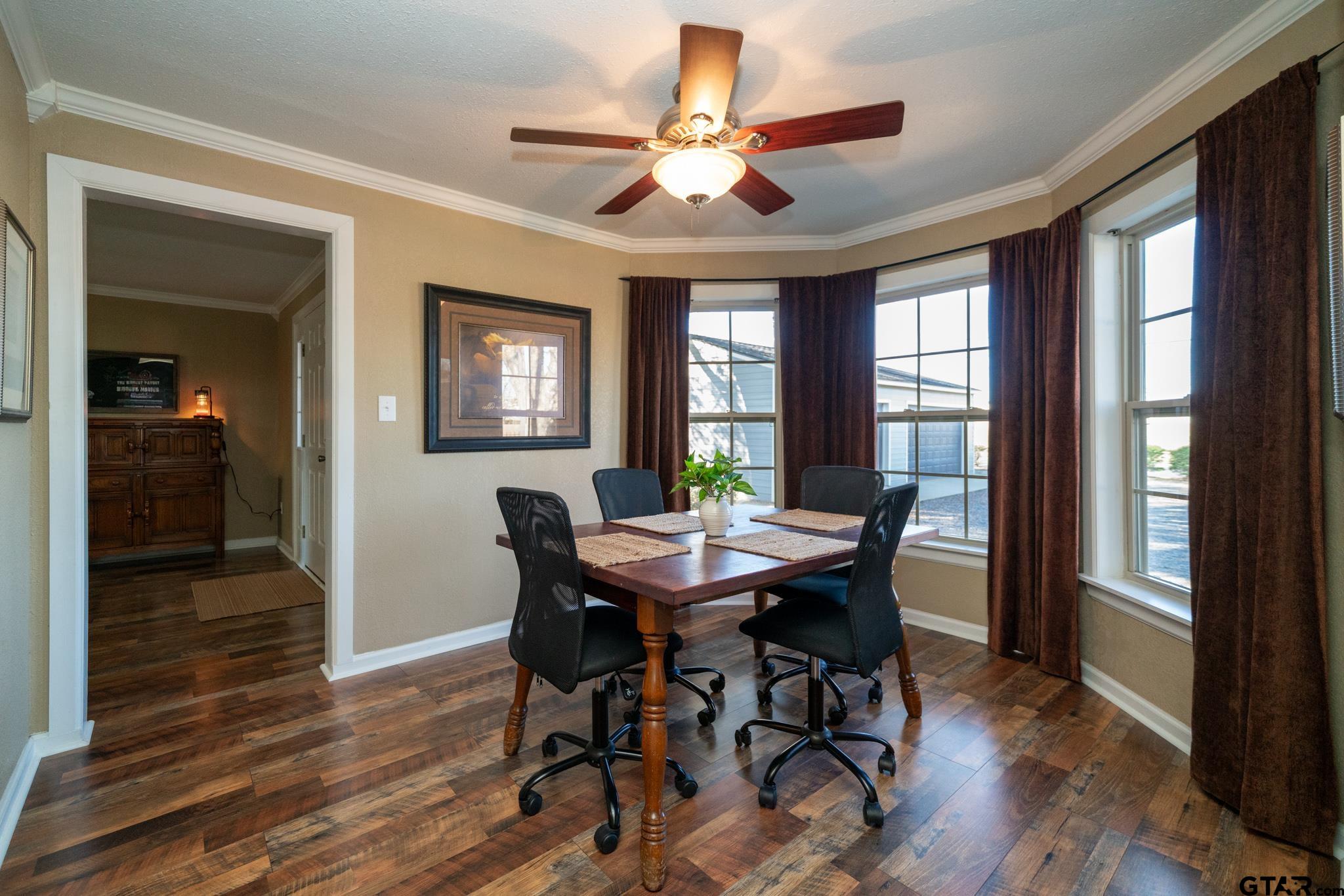 4538 West Loop 281 Longview, TX 75604 - Photo 15 of 45 a view of a dining room with furniture window and wooden floor