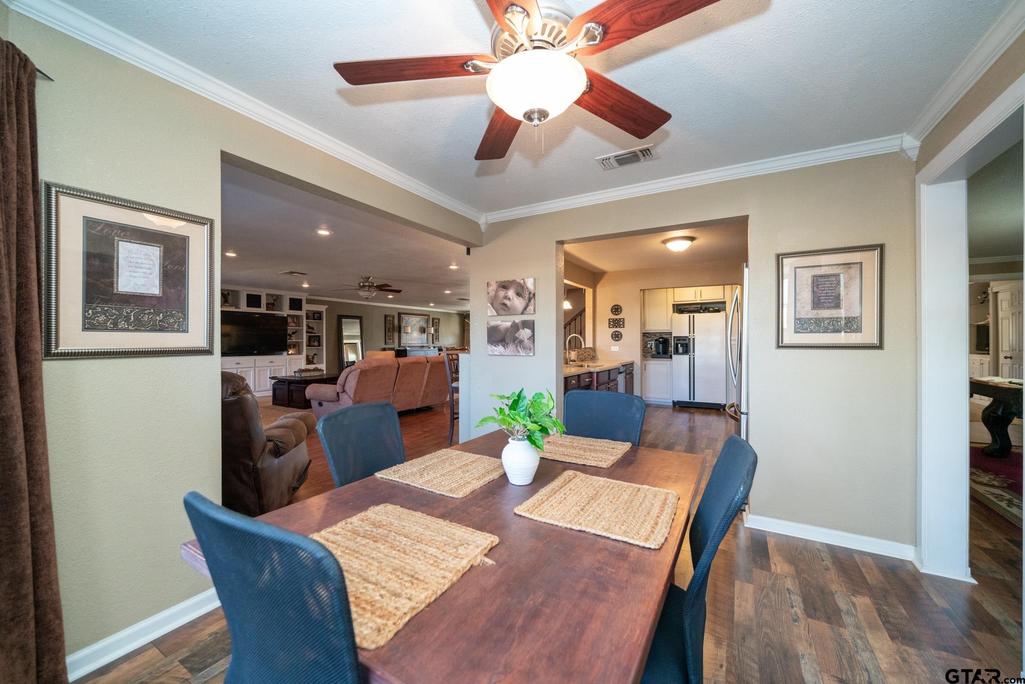 4538 West Loop 281 Longview, TX 75604 - Photo 16 of 45 a view of a dining room with furniture and wooden floor