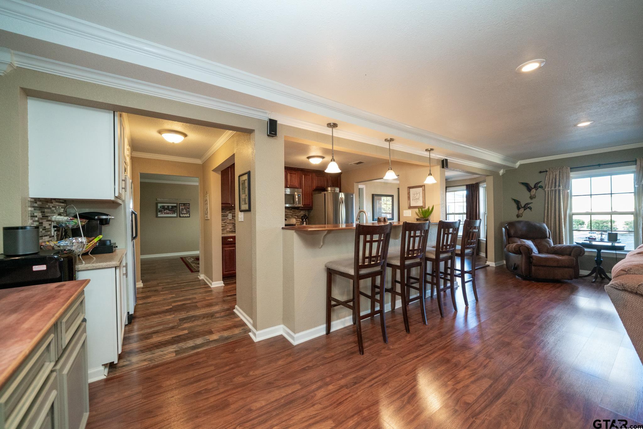 4538 West Loop 281 Longview, TX 75604 - Photo 21 of 45 a view of a dining room with furniture and wooden floor