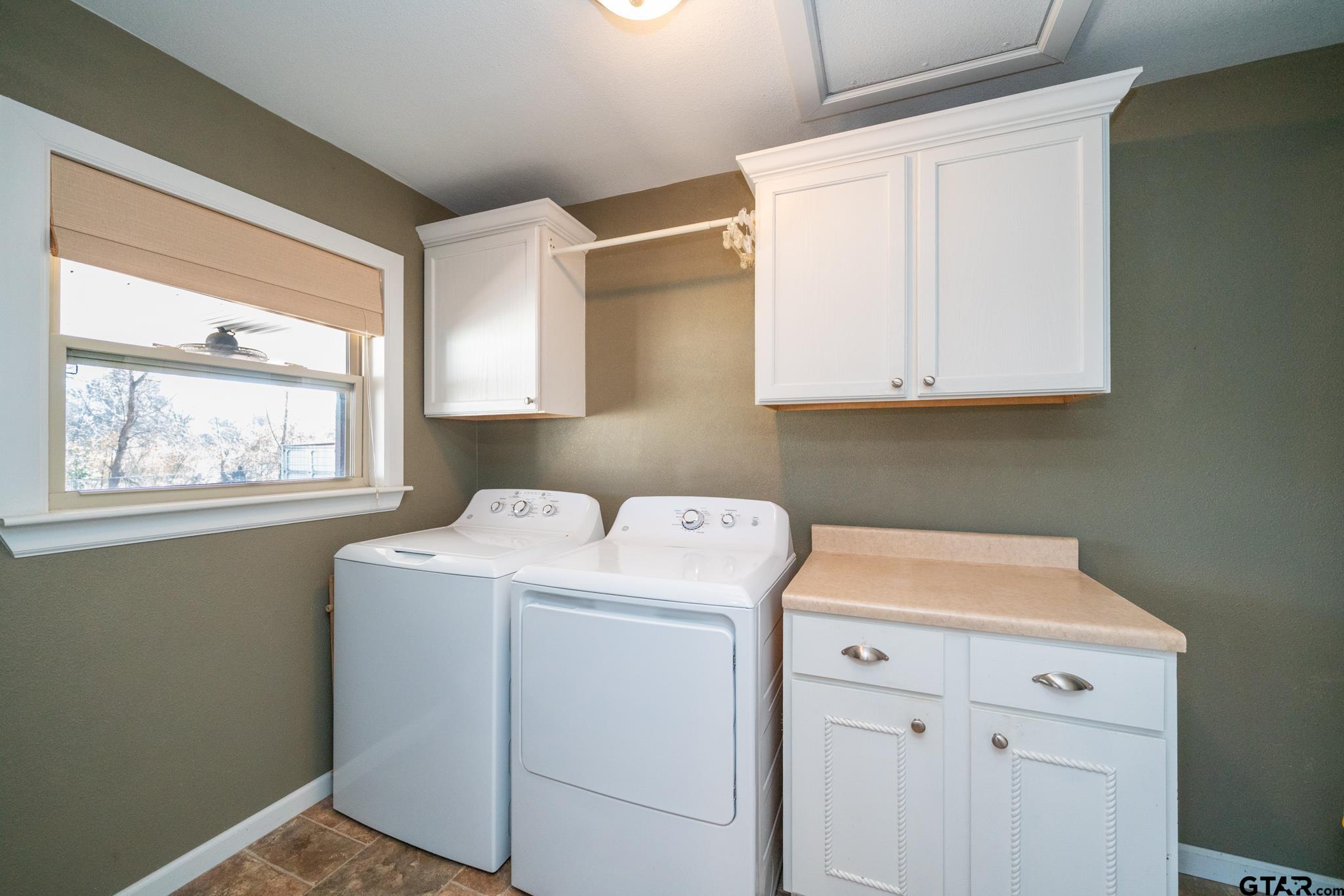 4538 West Loop 281 Longview, TX 75604 - Photo 29 of 45 a utility room with dryer and washer