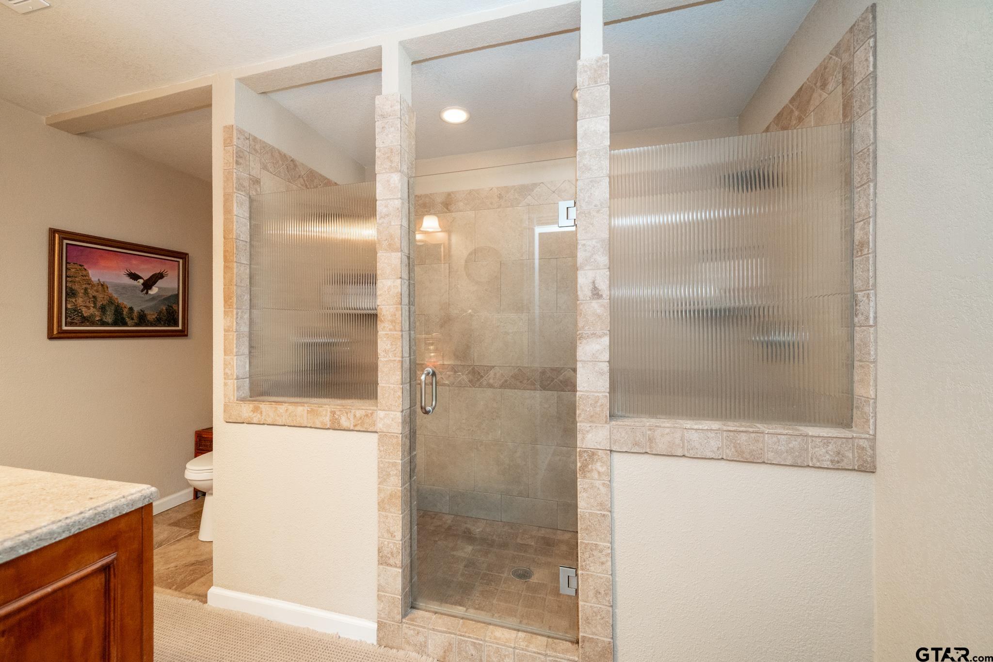 4538 West Loop 281 Longview, TX 75604 - Photo 34 of 45 a bathroom with a shower and a sink