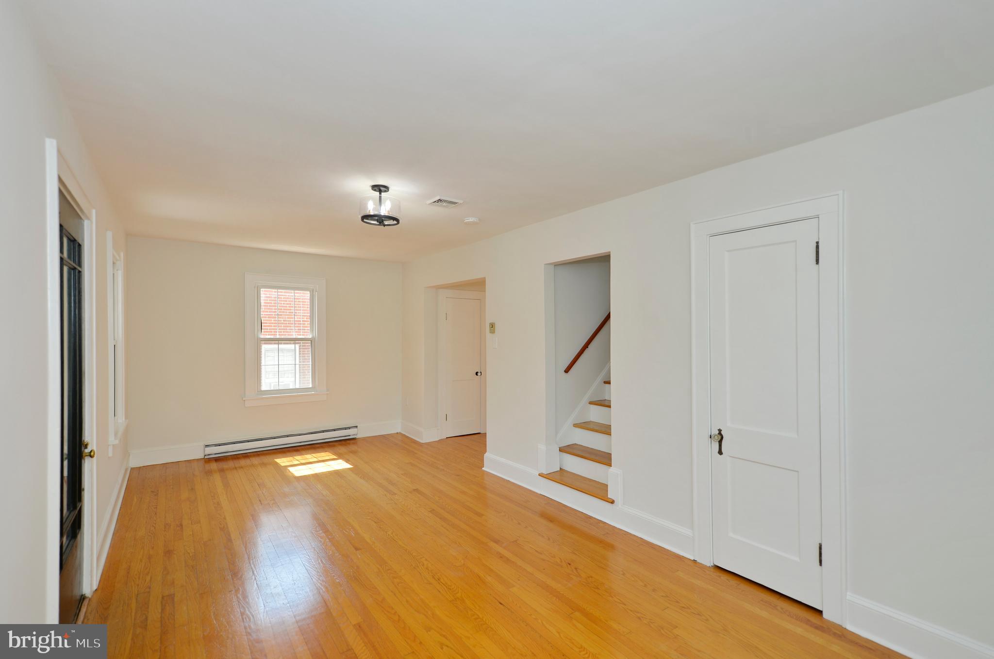 31 West Whitlock Avenue Winchester, VA 22601 - Photo 15 of 37 a view of an empty room with wooden floor and a window