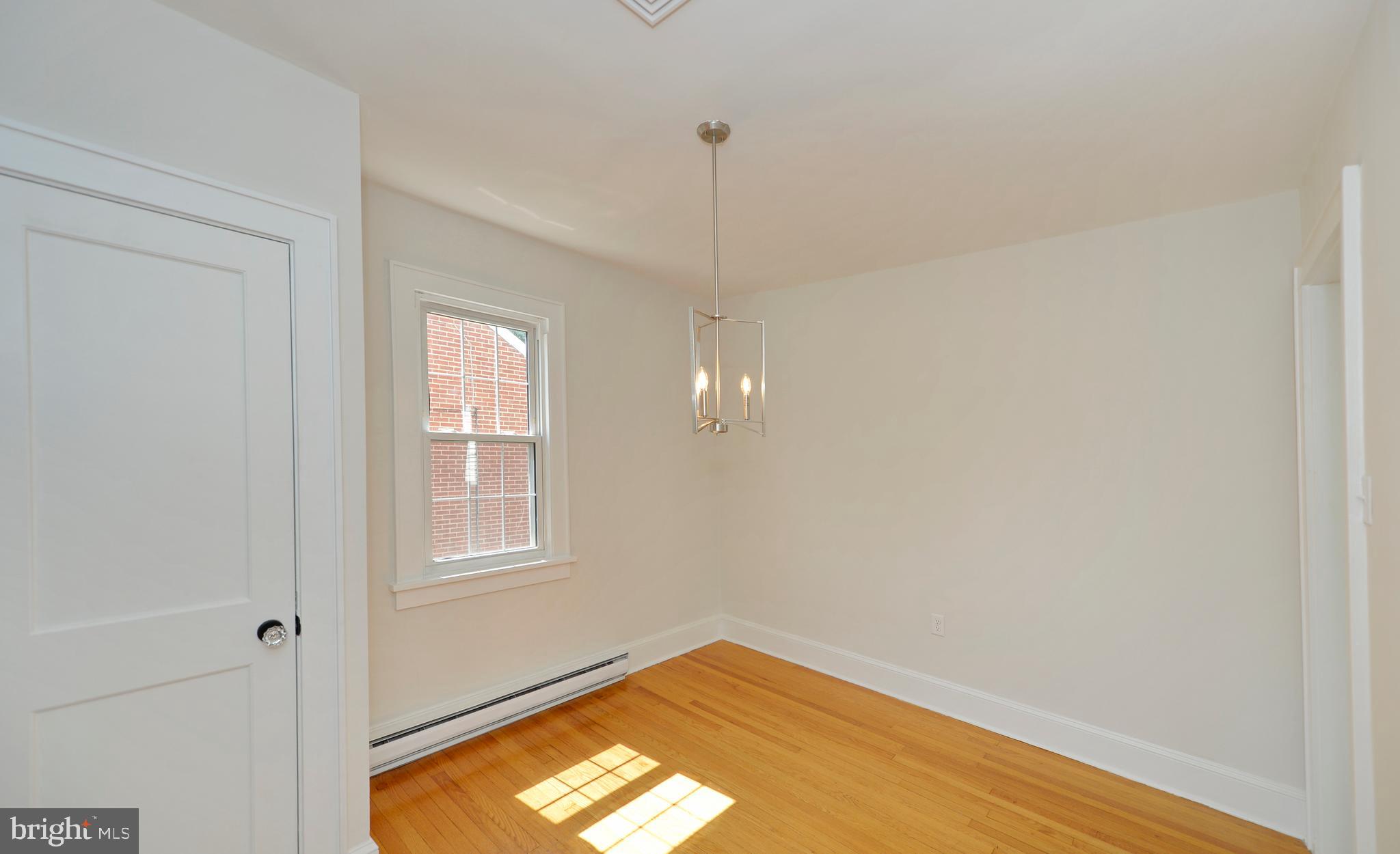 31 West Whitlock Avenue Winchester, VA 22601 - Photo 17 of 37 a view of empty room with window and wooden floor