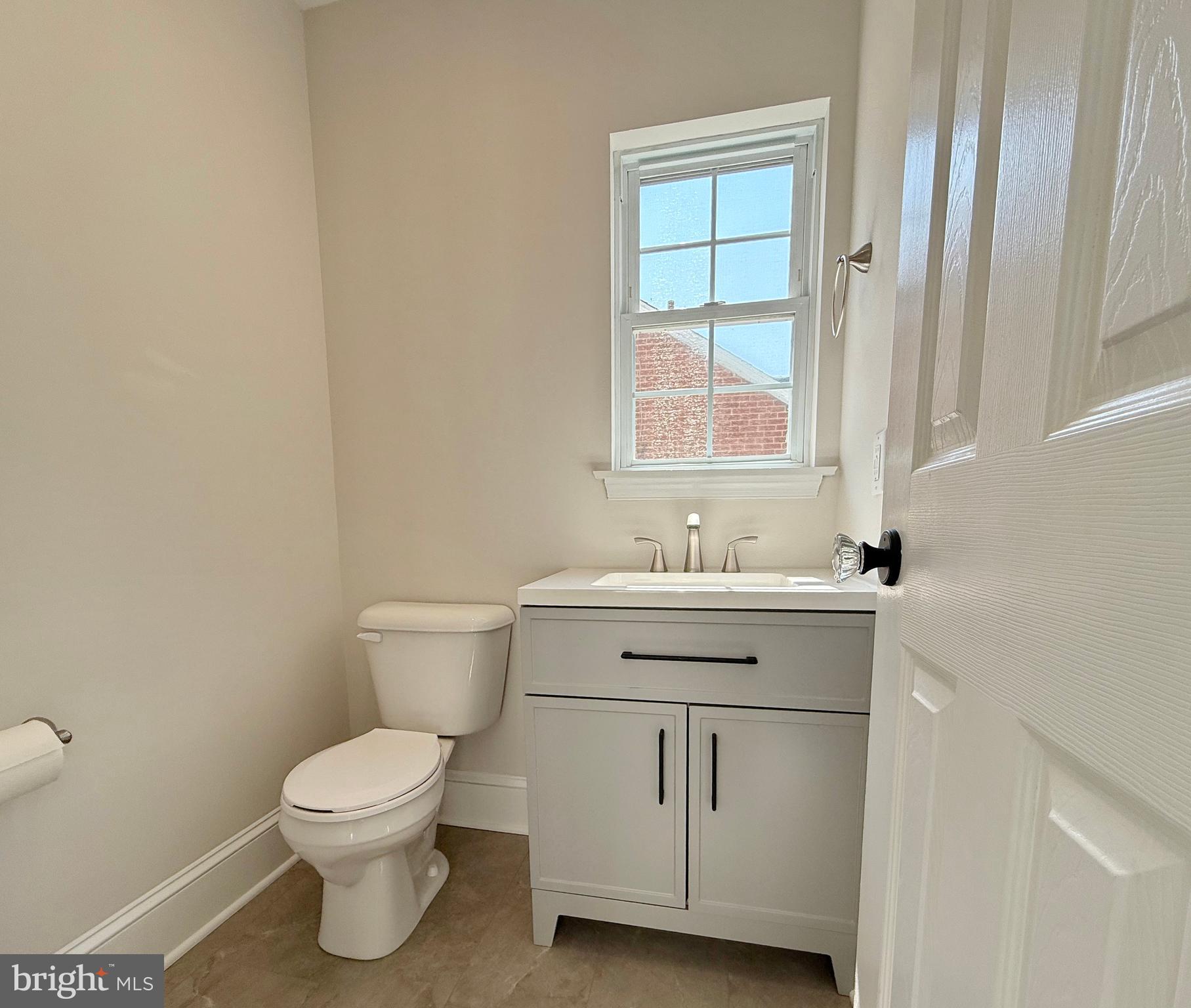 31 West Whitlock Avenue Winchester, VA 22601 - Photo 22 of 37 a bathroom with a sink toilet and window