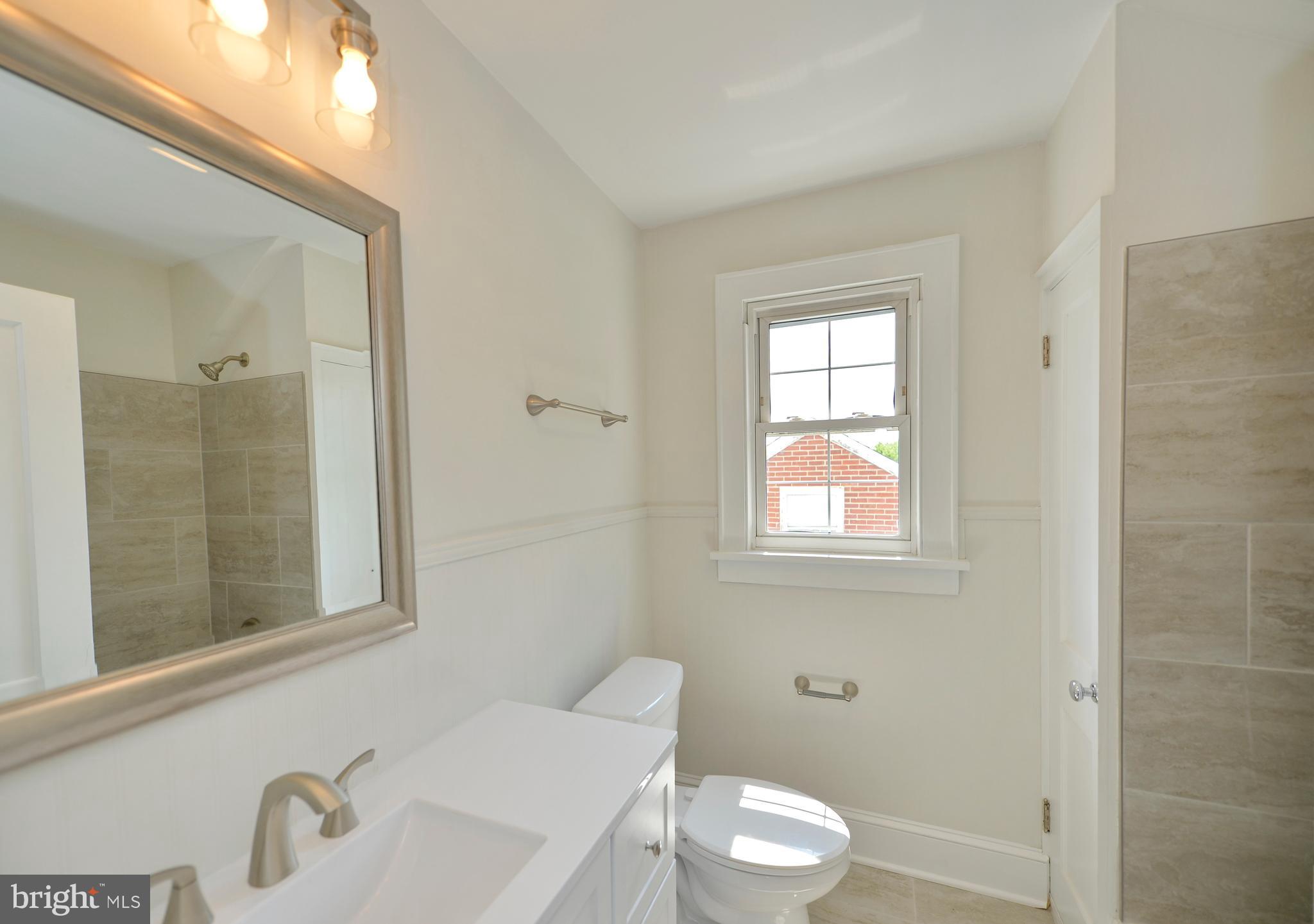 31 West Whitlock Avenue Winchester, VA 22601 - Photo 27 of 37 a bathroom with a sink a toilet and shower