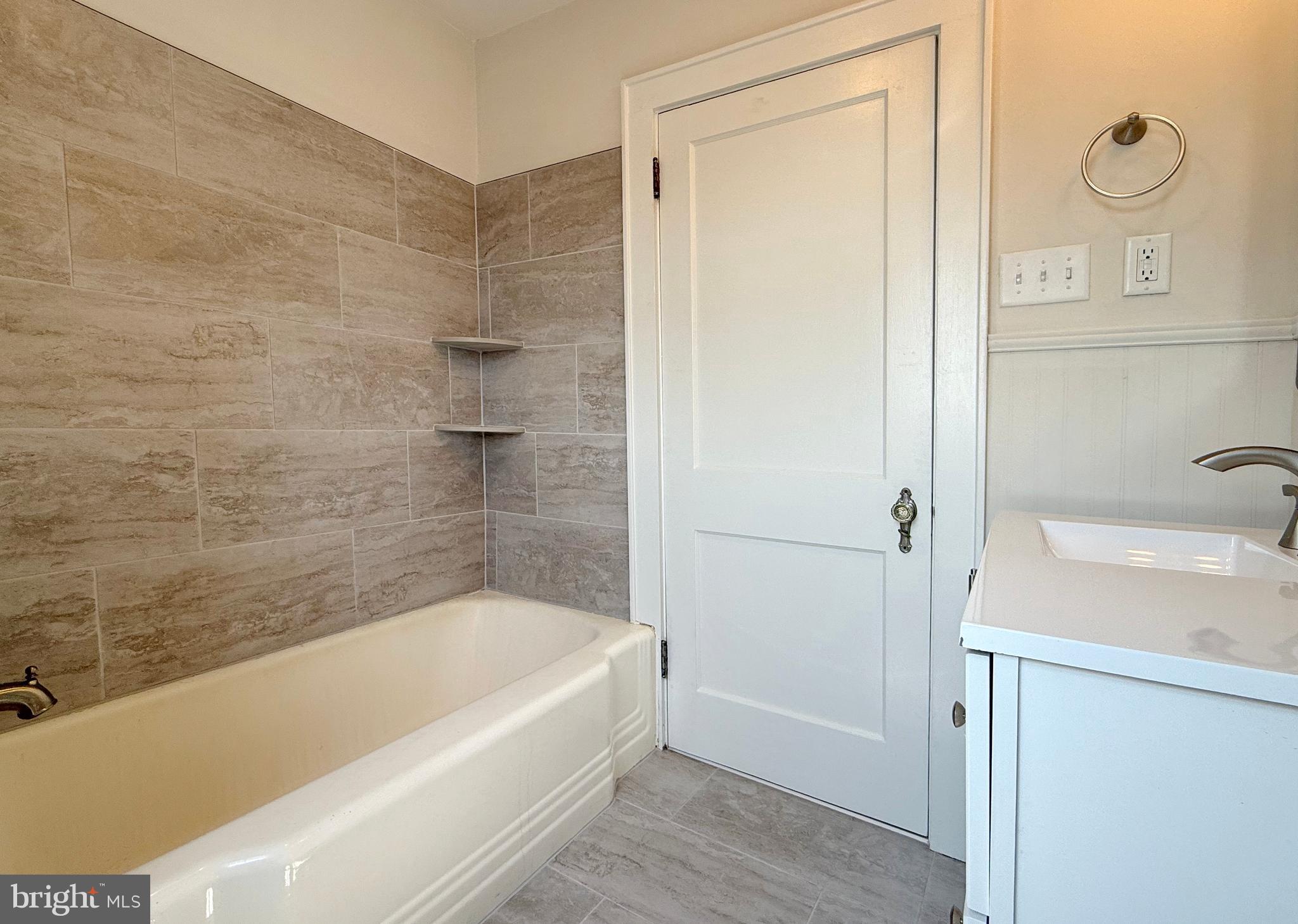31 West Whitlock Avenue Winchester, VA 22601 - Photo 28 of 37 a bathroom with a tub a sink and a shower