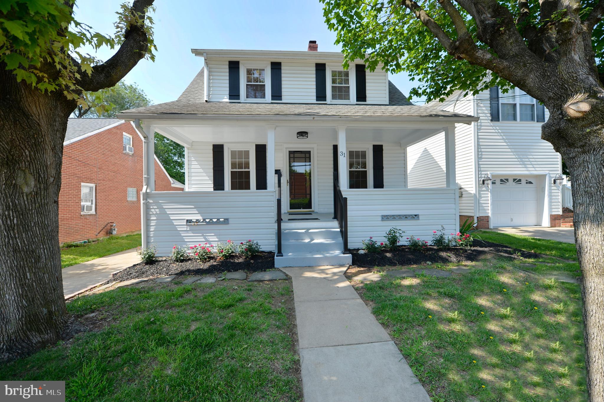 31 West Whitlock Avenue Winchester, VA 22601 - Photo 9 of 37 a front view of a house with a yard