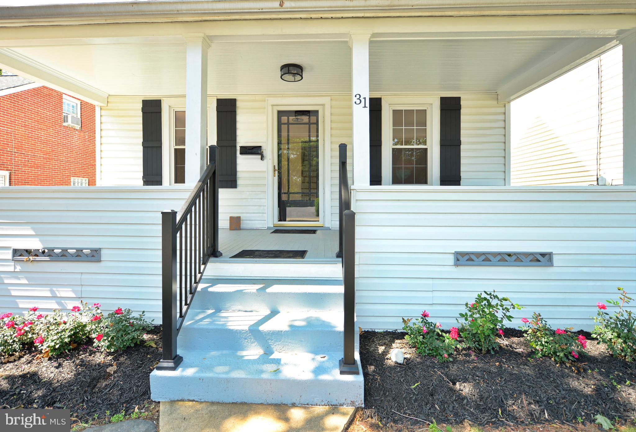 31 West Whitlock Avenue Winchester, VA 22601 - Photo 10 of 37 a view of a porch with a bench