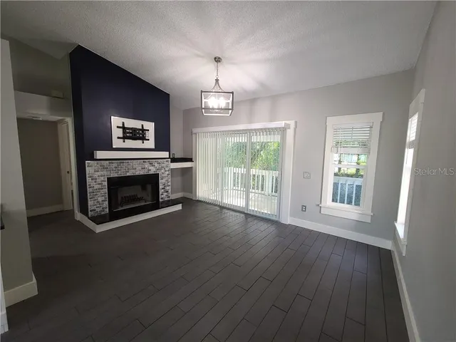 a kitchen with stainless steel appliances granite countertop a refrigerator a sink and a stove