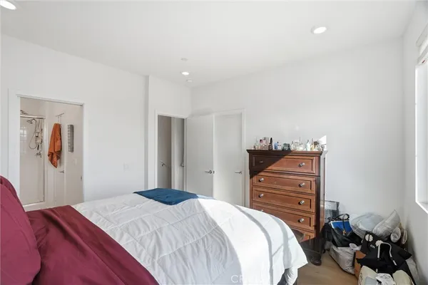 a bedroom with a bed and dresser