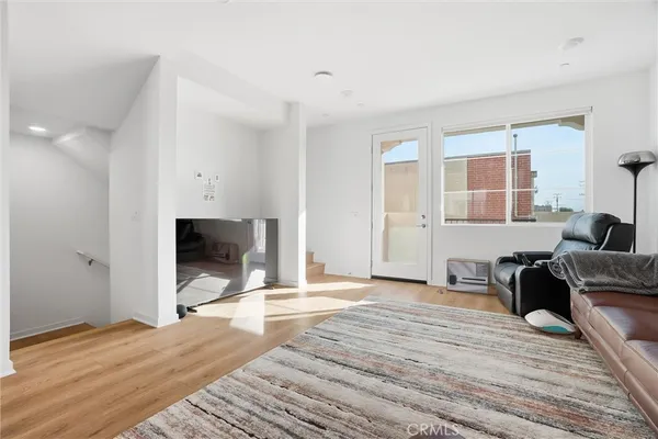 a view of a livingroom with furniture and wooden floor