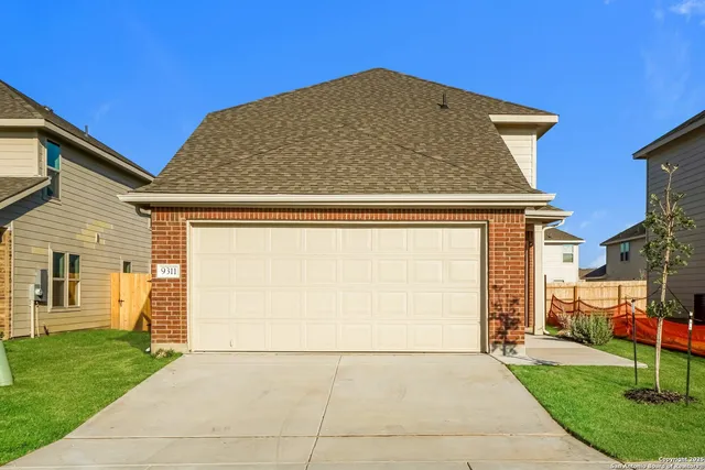 a view of backyard of garage