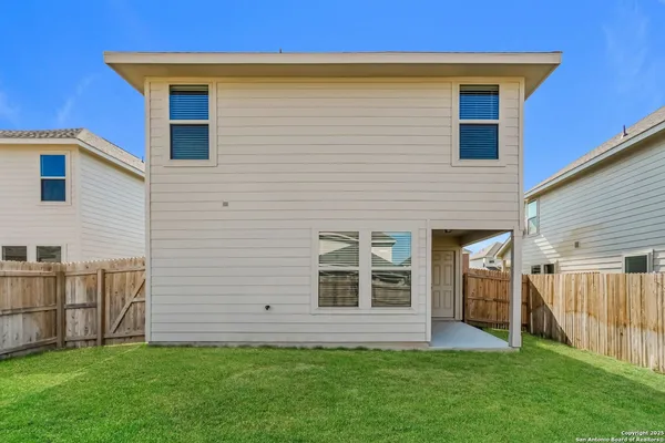 a view of front of house with a yard