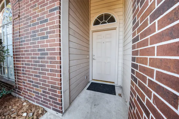 a view of a door with a door and wooden floor