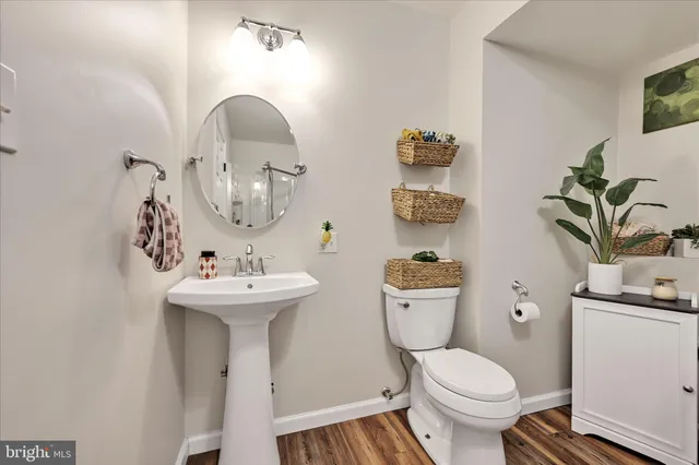 a living room with sink and a toilet