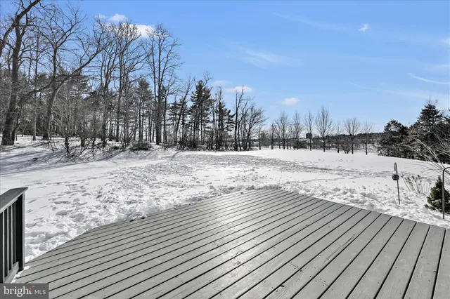 a view of a house with a snow in the background