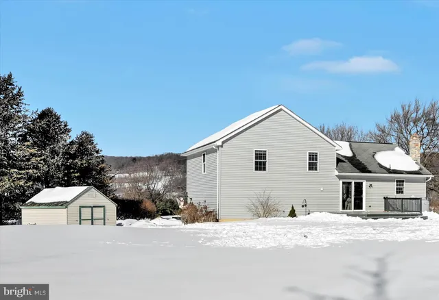 a view of white house with a yard