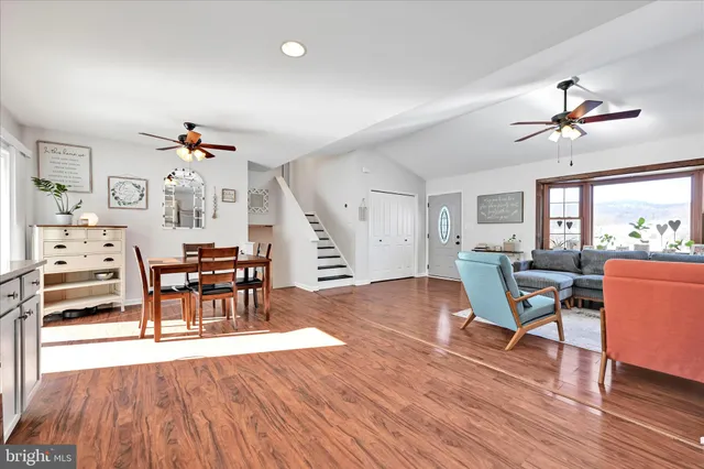a view of a livingroom with furniture and wooden floor