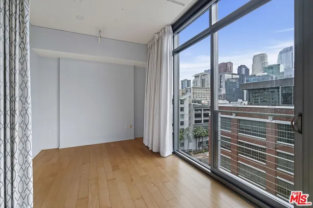 a view of a room that has a large window