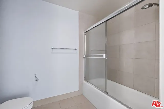 a bathroom with a bathtub and toilet