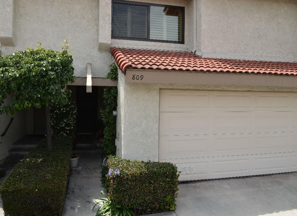 Front of condo with direct garage access.