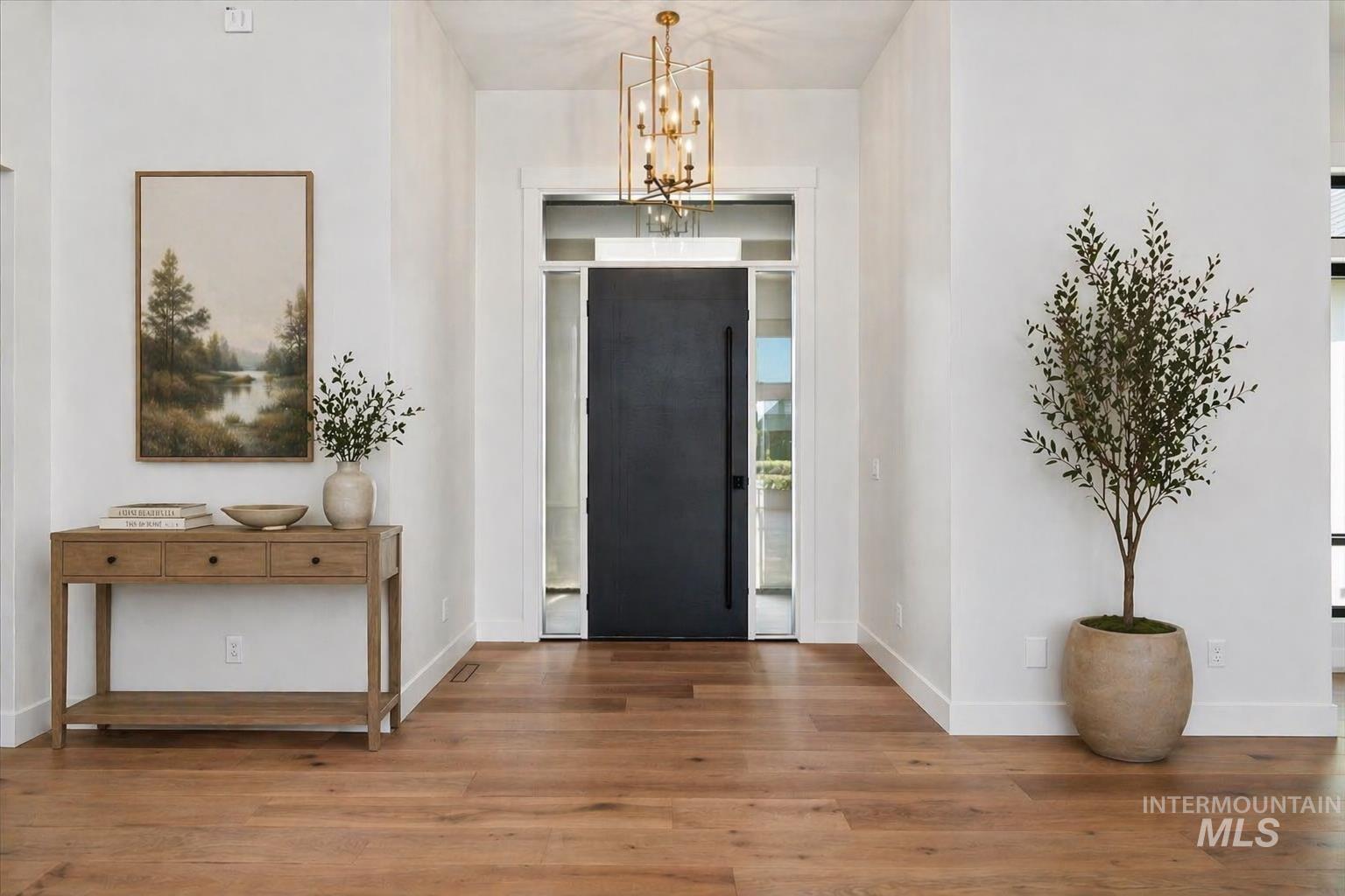 539 Century Avenue Middleton, ID 83644 - Photo 5 of 50 Entrance foyer featuring wood finished floors and hanging lights