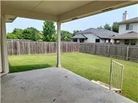a view of a backyard with a small cabin