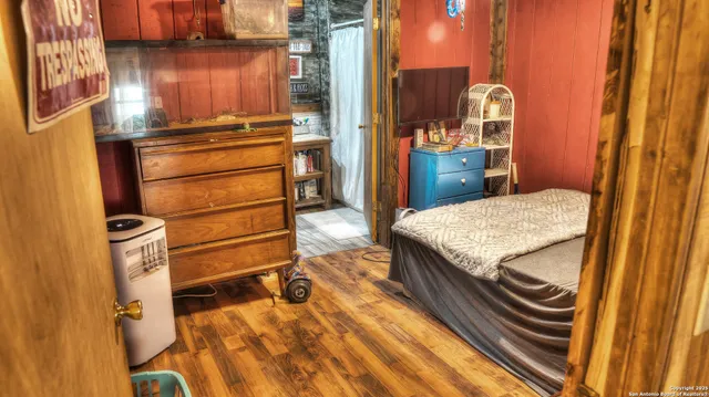 a bathroom with a sink a mirror and next to a window