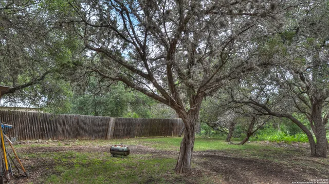 a view of a patio with a table and chairs