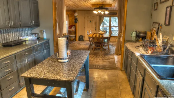 a kitchen with counter top space and appliances