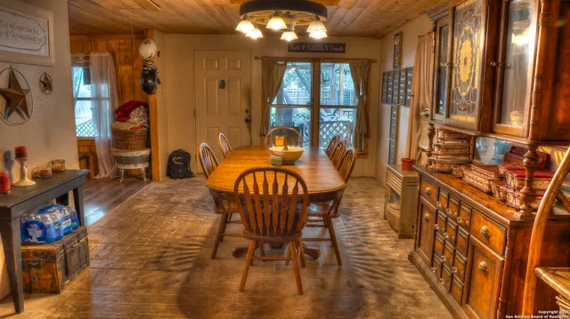 a view of a dining room with furniture and chandelier kitchen view