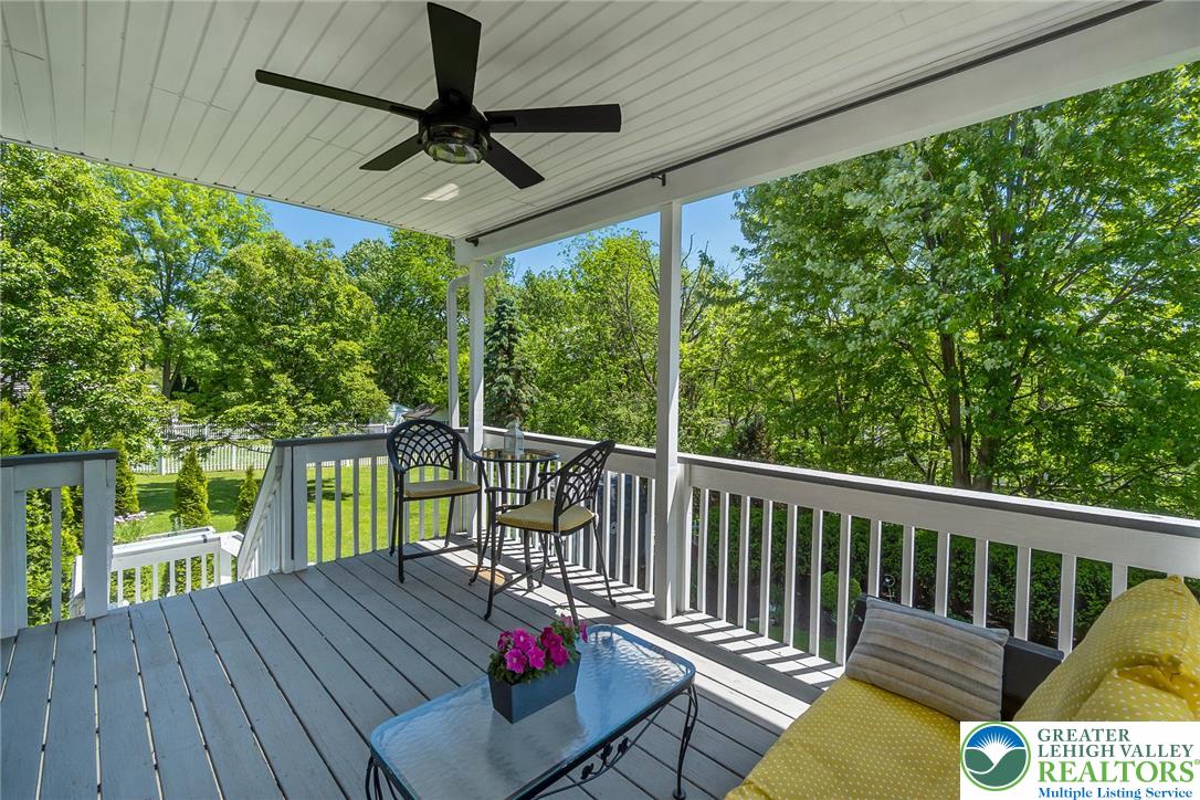 2314 Red Maple Drive Coplay, PA 18037 - Photo 57 of 73 An inviting covered deck offers serene views of lush greenery, perfect for relaxed outdoor living.