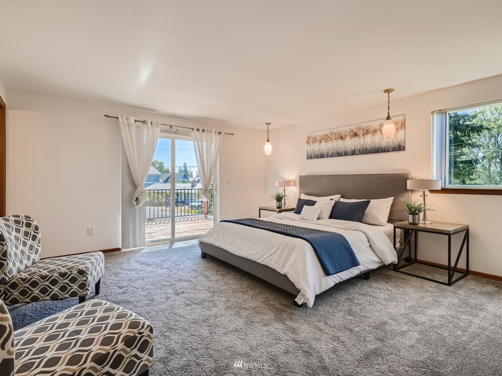 904 9th Street Snohomish, WA 98290 - Photo 13 of 40 a spacious bedroom with a bed and glass window