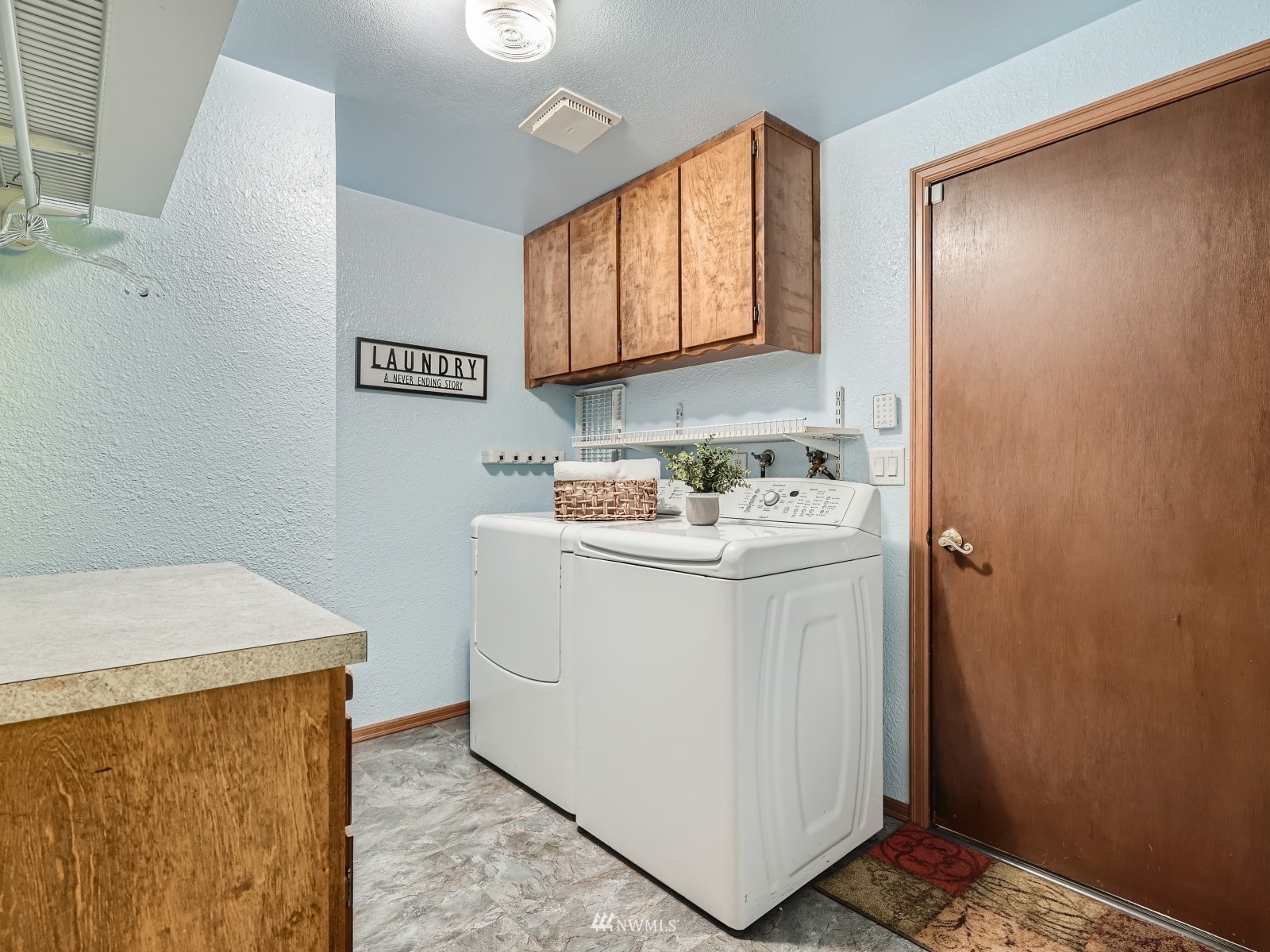 904 9th Street Snohomish, WA 98290 - Photo 24 of 40 a utility room with a sink a washer and dryer