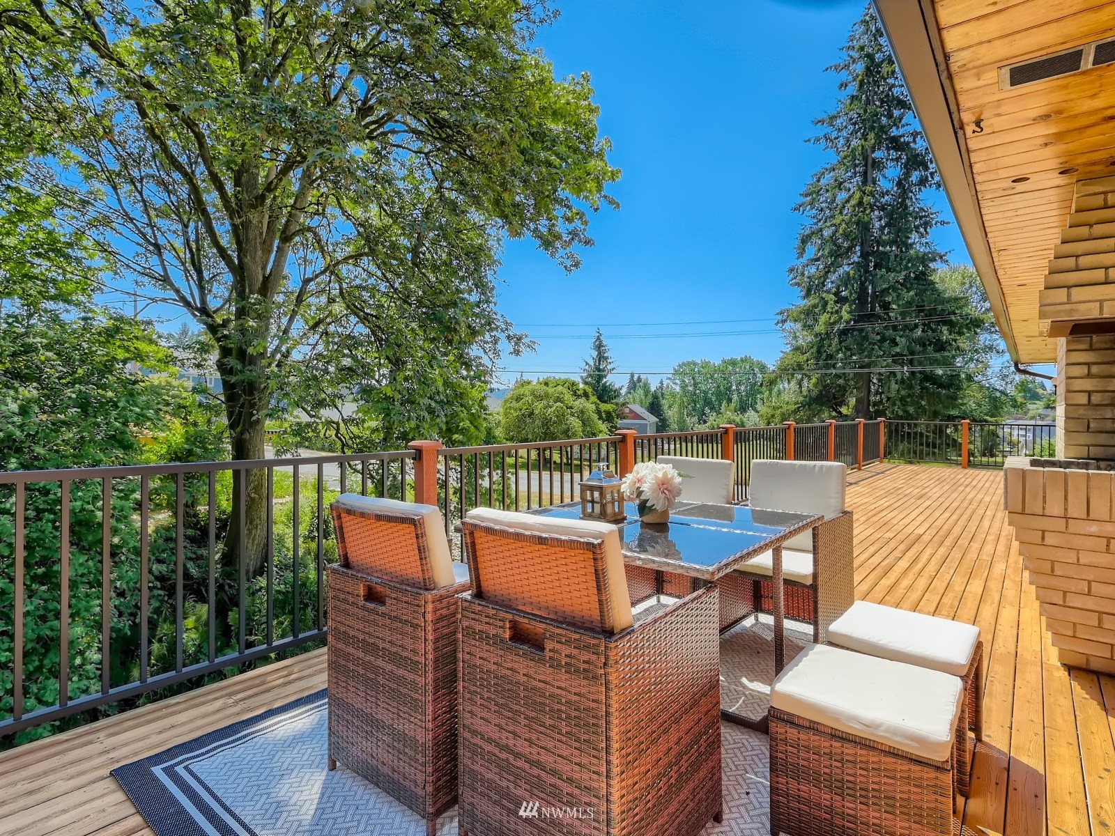 904 9th Street Snohomish, WA 98290 - Photo 25 of 40 a view of a balcony with wooden floor and outdoor seating