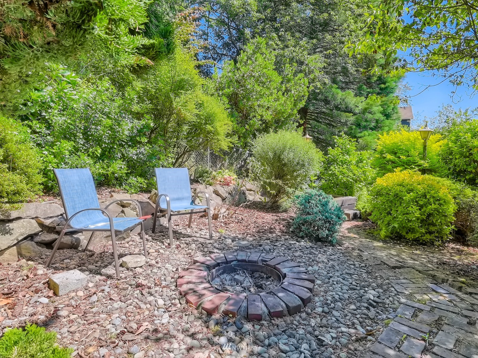 904 9th Street Snohomish, WA 98290 - Photo 32 of 40 a view of a backyard with chairs and a garden