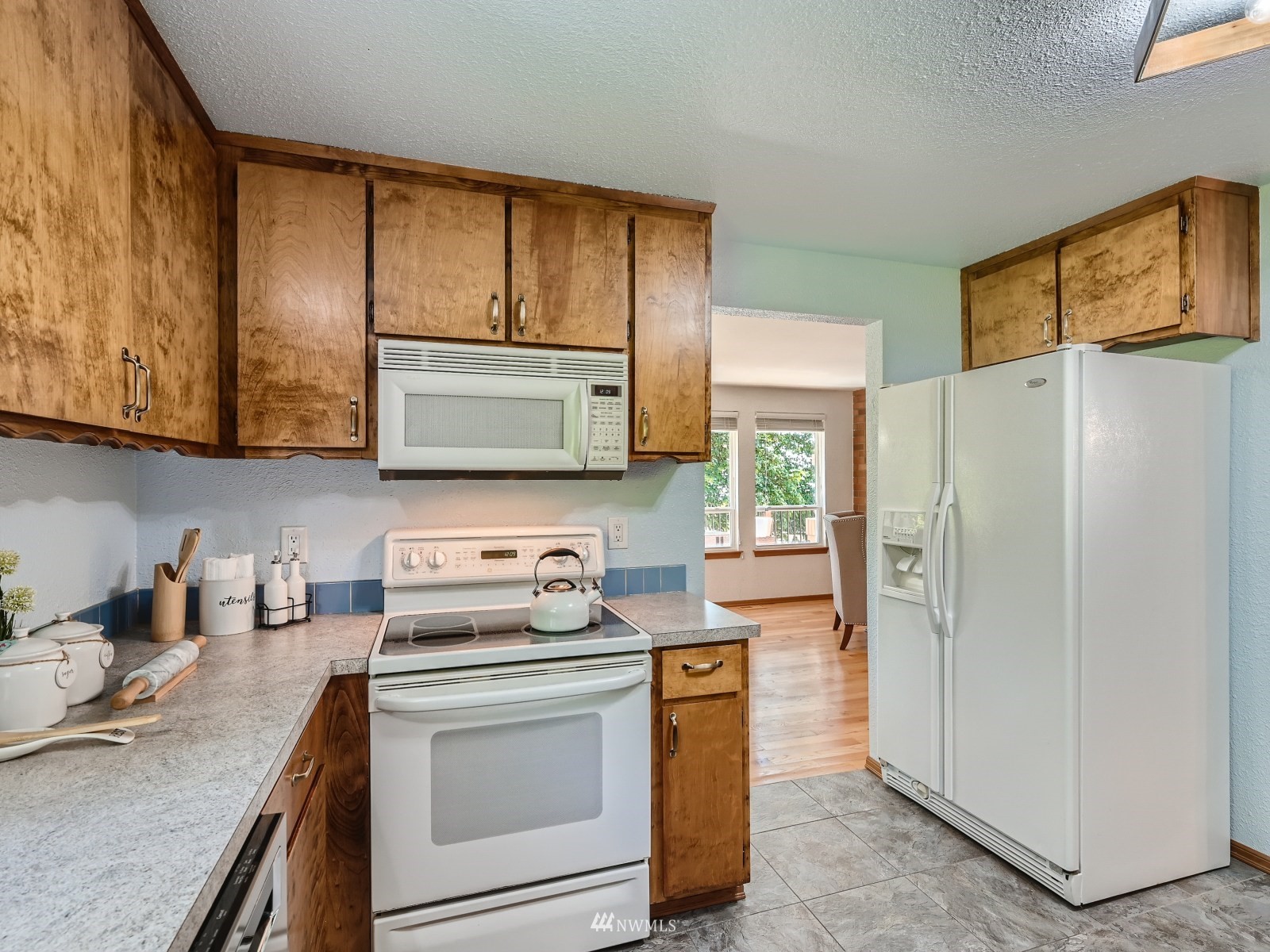 904 9th Street Snohomish, WA 98290 - Photo 9 of 40 a kitchen with stainless steel appliances a stove microwave and refrigerator