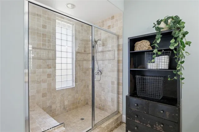 a bathroom with a tub and a window